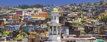 CHILE  Valparaiso The steeple of Iglesia Matriz with typical Valparaiso housing rising behind. Steep Holidays Travel Tourism Latin America Chile Valparaiso UNESCO World Heritage Site South America Colour Haphazard Jumble Urban Architecture American Chilean Color Hispanic Latino