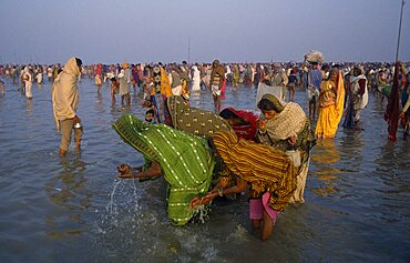 Pilgrims bathing in the River ganges during the Ganga Sagar Festival, River Ganges, India