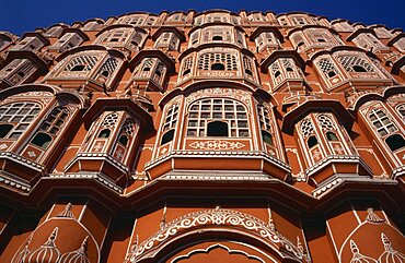 Hawa Mahal or Palace of the Winds, View looking up at the pink facade of the Rajput style architecture, Jaipur, Rajasthan, India