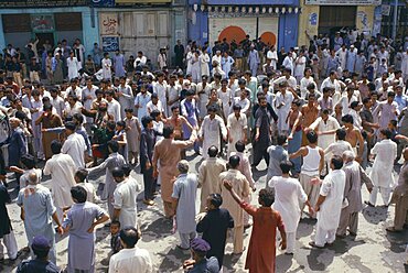 Mohurrum Festival, Men beating their chests durring Shia muslim festival of mourning to commemorate the death of Husayn ibn Ali grandson of Muhammad, Peshawar, Pakistan