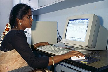 Young Indian woman using computer, Bangalore, Karnataka, India