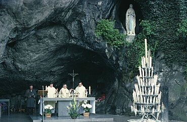 Lourdes, Priests conducting service at cave shrine in pilgrimage centre, Hautes-Pyrenees, Midi-Pyrenees, France