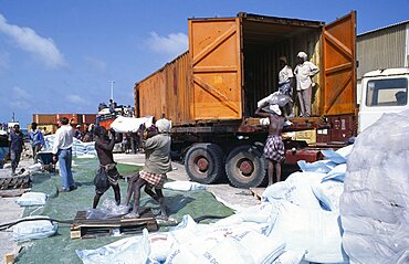 Loading French food aid of wheat flour onto truck for distribution from Mogadishu port, Mogadishu, Somalia, Africa