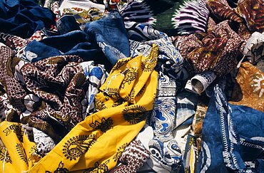 Local dyed and printed fabrics for sale in market, Dakar, Senegal, Africa