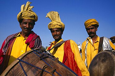 Portrait of three drummers, Pakistan, Asia