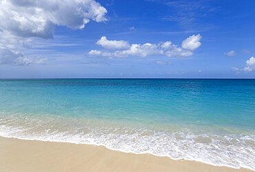 Waves breaking on the shore at Grand Anse Beach with the turquoise sea beyond Beaches Resort, Grenada, West Indies, Caribbean, Central America