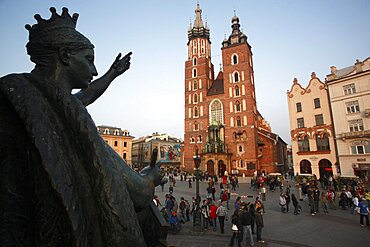 Poland, Krakow, Detail of female figure on monument to the polish romantic poet Adam Mickiewicz by Teodor Rygier in 1898 in the Rynek Glowny market square with Mariacki Basilica or Church of St Mary in the background