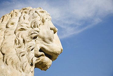 Italy, Veneto, Venice, Centro Storico, Arsenale, Head of guardian lion of free Venice statue against blue sky of late summer