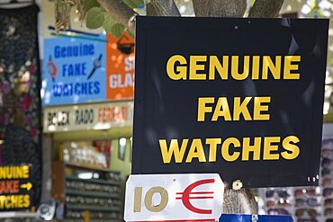 Turkey, Izmir Province, Selcuk, Ephesus, Sign advertising Genuine Fake Watches and ten Euro price ticket