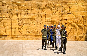 Turkey, Ankara, Anitkabir, Mausoleum of Mustafa Kemal Ataturk founder of the modern Turkish Republic and president in 1923. Changing of the Guard taking place in foreground of relief carved frieze.