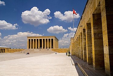 Turkey, Ankara, Anitkabir, Mausoleum of Mustafa Kemal Ataturk founder of the modern Turkish Republic and president in 1923. Monumental structure set on hilltop with flight of steps to colonnaded entrance and bordered by further colonnades flying Turkish flag.