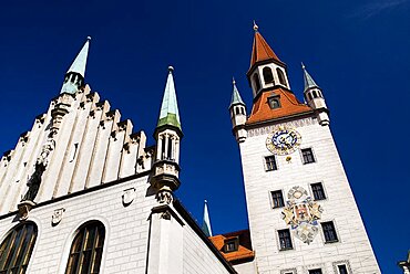 Germany, Bavaria, Munich, Marienplatz. Altes Rathaus or Old Town Hall. Original building dating from the fifteenth century with baroque facade added in the seventeenth century. Angled detail of facade and clock tower.