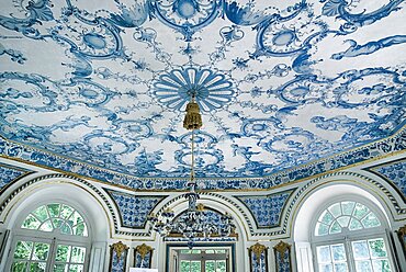 Germany, Bavaria, Munich, Nymphenburg Palace the Pagodenburg. Interior of elegant pavilion for royal relaxation with over 2000 blue and white painted Dutch tiles decorating the walls and ceiling.