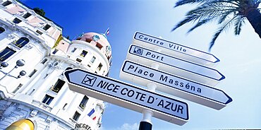 FRANCE Provence-Cote d Azur Nice Promenade des Anglais.  Angled view of directional road sign in front of the Hotel Negresco  partly seen behind.  Alpes Maritimes