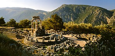 GREECE Central Greece Delphi Sanctuary of Athena.  View over ruins in mountain landscape.