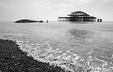 Ruins of the burnt out West Pier fallen into the sea, Brighton, East Sussex, England