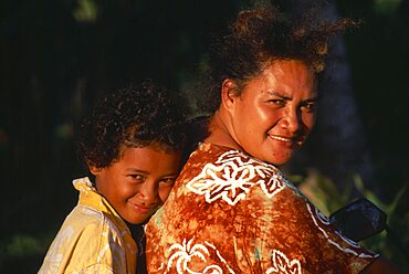 PACIFIC ISLANDS Cook Islands Aitutaki  Near Vaipae. Portrait of smiling mother and daughter