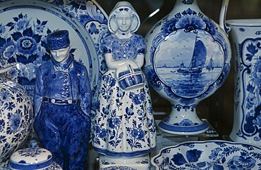 HOLLAND Zuid Holland Delft Close up view of a display of delftware in a shop called De Porceleyne Fles.