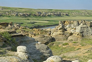 Canada, Alberta, Writing-on-Stone Provincial Park, The hoodoos and the Milk River, The park is sacred to the Blackfoot and other aboriginal tribes and is home to the largest collection of rock art on the North American prairies, Pictographs and Petroglyphs possibly 3,500 years old, Canada has applied for UNESCO World Heritage status for the site.