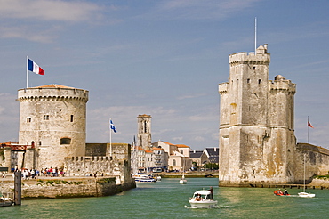 The towers of La Chaine and St. Nicholas at the entrance to the ancient port of La Rochelle, Charente-Maritime, France, Europe