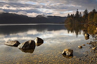 A brief glimpse of morning sunlight at Derwent Water, Lake Diestrict National Park, Cumbria, England, United Kingdom, Europe