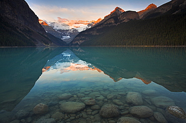 First light on the mountains overlooking Lake Louise, Banff National Park, UNESCO World Heritage Site, Alberta, Rocky Mountains, Canada, North America