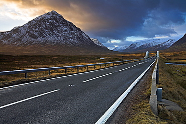 The A82 passing Buachaille Etive Mor as it winds through Rannoch Moor towards Glen Coe, Highland, Scotland, United Kingdom, Europe