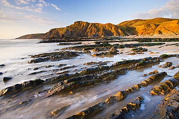 Eroded ledges exposed at low tide, Sandymouth, North Cornwall, England, United Kingdom, Europe