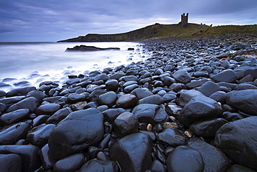 Stormy morning on the coast beside Dunstanburgh Castle, Dunstanburgh, Northumberland, England, United Kingdom, Europe