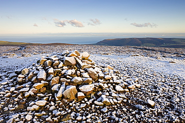 Stone Cairn at Dunkery Beacon on a snowy winters morning, Exmoor National Park, Somerset, England, United Kingdom, Europe