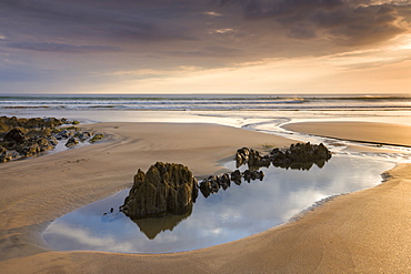 Rockpools on sandy Coombesgate Beach at low tide, Woolacombe, Devon, England, United Kingdom, Europe