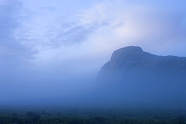 Haytor surrounded by mist on a moody summer evening, Dartmoor National Park, Devon, England, United Kingdom, Europe