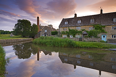 Cottages in the picturesque Cotswolds village of Lower Slaughter at sunrise, Gloucestershire, The Cotswolds, England, United Kingdom, Europe