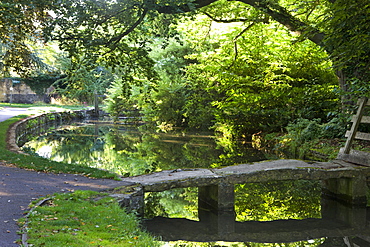 Stone footbridge over the River Eye in the Cotswolds village of Lower Slaughter, Gloucestershire, The Cotswolds, England, United Kingdom, Europe