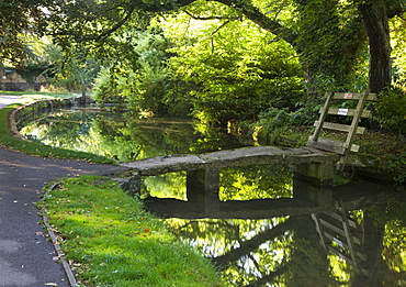 Stone footbridge over the River Eye in the Cotswolds village of Lower Slaughter, Gloucestershire, The Cotswolds, England, United Kingdom, Europe