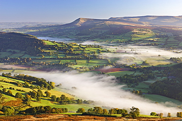 Mist covered rolling countryside backed by the Black Mountains, Brecon Beacons National Park, Powys, Wales, United Kingdom, Europe