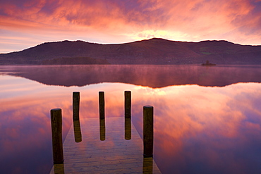 Mist at sunrise over Derwent Water, Lake District National Park, Cumbria, England, United Kingdom, Europe