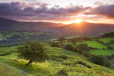 Sunrise over the Sugarloaf and town of Crickhowell, Brecon Beacons National Park, Powys, Wales, United Kingdom, Europe