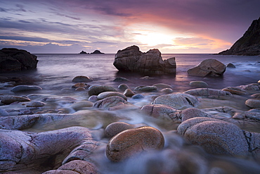 Sunset over the Brisons and Porth Nanven, a rocky cove near Land's End, Cornwall, England, United Kingdom, Europe