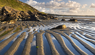 Patterns in the sand at low tide on Tregardock Beach, Cornwall, England, United Kingdom, Europe