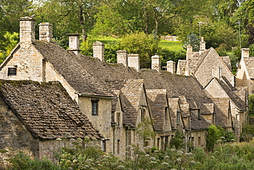 Picturesque cottages at Arlington Row in the Cotswolds village of Bibury, Gloucestershire, England, United Kingdom, Europe