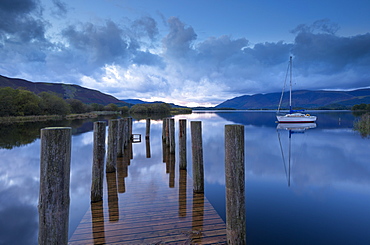 Wooden jetty and yacht on Derwent Water near Lodore, Lake District National Park, Cumbria, England, Great Britain, United Kingdom, Europe