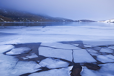 Broken ice on the surface of Llyn y Fan Fawr in the Black Mountains, Brecon Beacons National Park, Wales, United Kingdom, Europe 