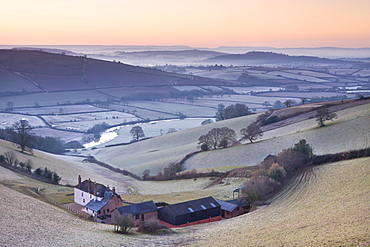 Frost coated countryside and farm buildings at sunrise, Exe Valley, Devon, England, United Kingdom, Europe 