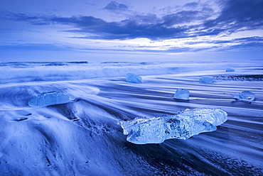 Ice and waves on Jokulsarlon Beach in winter, South Iceland, Polar Regions 