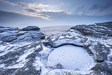 Snow dusted Kes Tor showing Dartmoor's largest rock basin, Dartmoor National Park, Devon, England, United Kingdom, Europe 