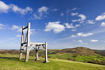 Modern oak wooden sculpture by artist Henry Bruce entitled The Giants Chair at Natsworthy in Dartmoor National Park, Devon, England, United Kingdom, Europe 