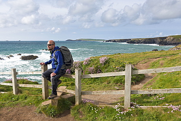 Man walking the South West Coast Path near Trevose Head, Cornwall, England, United Kingdom, Europe