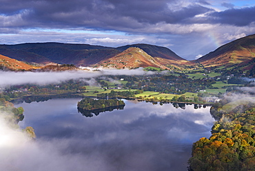 Mist burns off Lake Grasmere in the early morning, Lake District National Park, Cumbria, England, United Kingdom, Europe