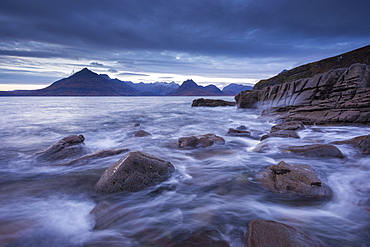 Waves rush around the rocky shores of Elgol, Isle of Skye, Inner Hebrides, Scotland, United Kingdom, Europe